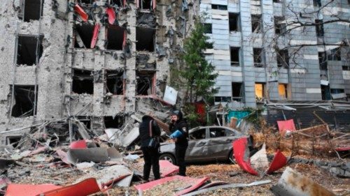 TOPSHOT - Police experts examine commercial and office buildings destroyed after the Russian strike ... TOPSHOT - Police experts examine commercial and office buildings destroyed after the Russian strike ...