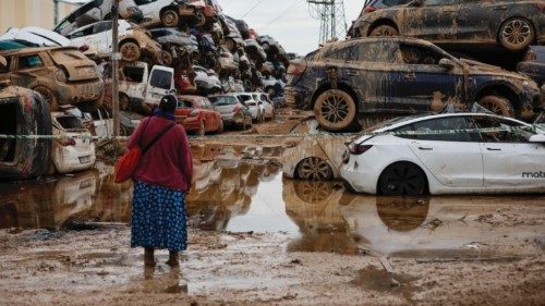 epa11710226 A woman looks up several cars piled up on a street in Paiporta, in Valencia, Spain, 08 ... epa11710226 A woman looks up several cars piled up on a street in Paiporta, in Valencia, Spain, 08 ...