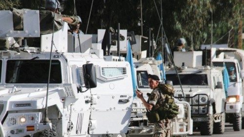 A Lebanese army soldier stands near UN peacekeepers (UNIFIL) vehicles in Marjayoun, near the border ... A Lebanese army soldier stands near UN peacekeepers (UNIFIL) vehicles in Marjayoun, near the border ...