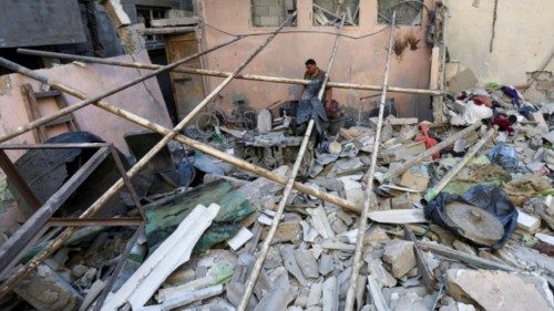 A Palestinian man inspects the site of an Israeli strike on a house in Nuseirat in the central Gaza ... A Palestinian man inspects the site of an Israeli strike on a house in Nuseirat in the central Gaza ...