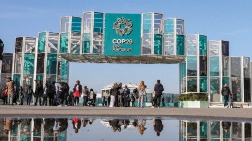 epaselect epa11722085 People walk outside the venue of the United Nations Climate Change Conference ...