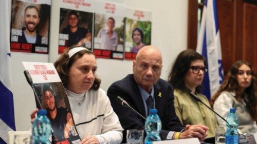 Yelena Troufanov, one of the hostages released by Hamas, holds a poster showing her son Alexander ... Yelena Troufanov, one of the hostages released by Hamas, holds a poster showing her son Alexander ...