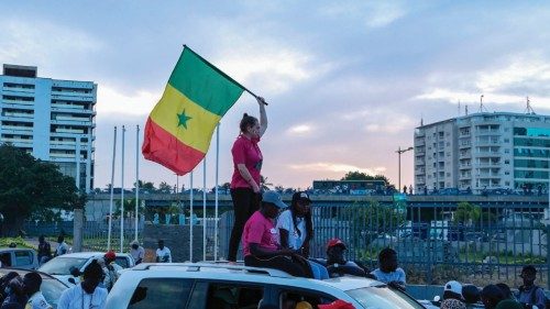 Senegal's Prime Minister and Pastef party's supporters, including one holding a national flag on a ... Senegal's Prime Minister and Pastef party's supporters, including one holding a national flag on a ...