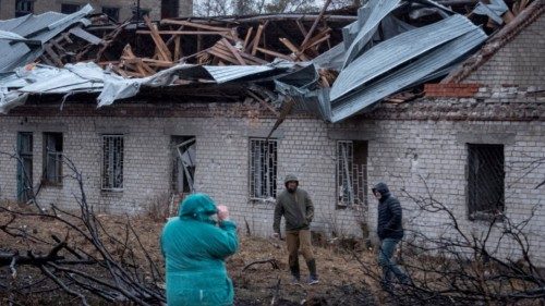 Residents walk at a site of a Russian missile strike, amid Russia's attack on Ukraine, in Dnipro, ... Residents walk at a site of a Russian missile strike, amid Russia's attack on Ukraine, in Dnipro, ...