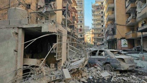 A damaged car lies amid the destruction in the aftermath of an Israeli airstrike that targeted the ... A damaged car lies amid the destruction in the aftermath of an Israeli airstrike that targeted the ...