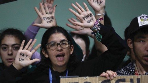 Activists hold a protest during the COP29 United Nations climate change conference, in Baku, ...
