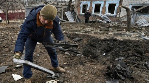 A man inspects parts of a kamikaze drone at a site of a residential area damaged by a Russian drone ... A man inspects parts of a kamikaze drone at a site of a residential area damaged by a Russian drone ...