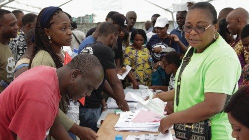 epa11724253 People prepare to cast their votes during the constitutional referendum at Ecole Urbaine ...
