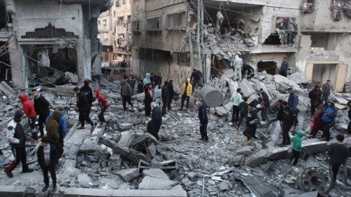 TOPSHOT - Palestinians inspect the damage at the site of an Israeli airstrike in the Nuseirat camp ... TOPSHOT - Palestinians inspect the damage at the site of an Israeli airstrike in the Nuseirat camp ...