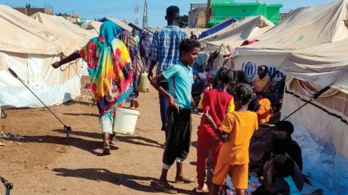 Sudanese people who fled escalating violence in the al-Jazira state are pictured at a camp for the ... Sudanese people who fled escalating violence in the al-Jazira state are pictured at a camp for the ...