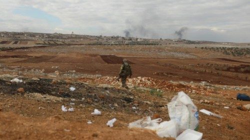 A fighters from Hayat Tahrir al-Sham (HTS) mans a position in the eastern outskirts of the town of ... A fighters from Hayat Tahrir al-Sham (HTS) mans a position in the eastern outskirts of the town of ...