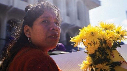 Indigenous Maya women hold flowers during a protest to mark the International Day for the ... Indigenous Maya women hold flowers during a protest to mark the International Day for the ...