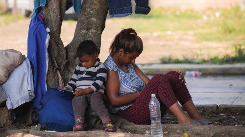 Migrants rest near railroad tracks while looking for a chance to get on a train and reach the United ... Migrants rest near railroad tracks while looking for a chance to get on a train and reach the United ...