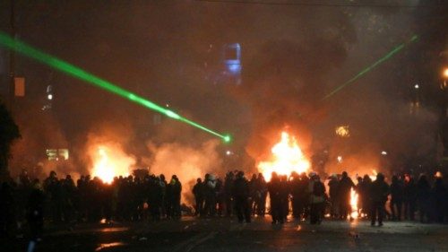 Demonstrators stand next to a fire during a protest against the new government's decision to suspend ... Demonstrators stand next to a fire during a protest against the new government's decision to suspend ...