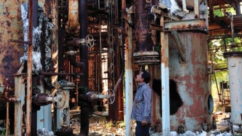 (FILES) A man looks at discarded machinery at the now-defunct Union Carbide factory in Bhopal on ... (FILES) A man looks at discarded machinery at the now-defunct Union Carbide factory in Bhopal on ...