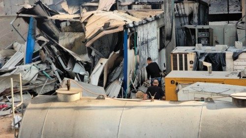 People check the damage outside the Kamal Adwan hospital in Beit Lahya in the northern Gaza Strip, ... People check the damage outside the Kamal Adwan hospital in Beit Lahya in the northern Gaza Strip, ...