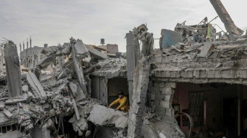 epaselect epa11761644 A Palestinian inspects his family destroyed house following Israeli airstrikes ...