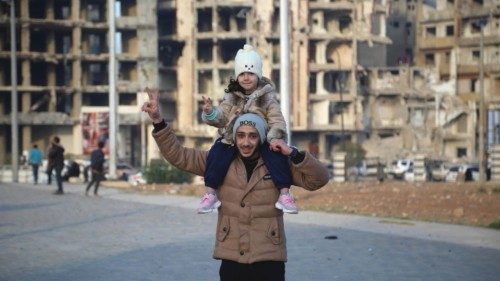 epa11765710 A man and a child gesture as people celebrate after Syrian rebels took over Damascus, in ... epa11765710 A man and a child gesture as people celebrate after Syrian rebels took over Damascus, in ...