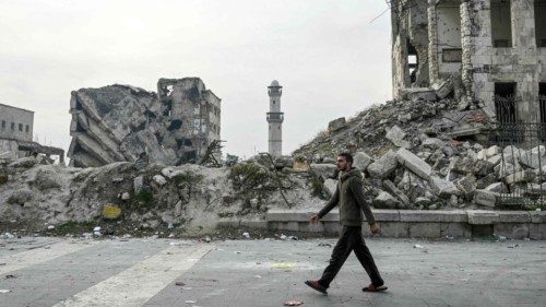 A man walks past the rubble of a damaged building at the Citadel of Aleppo in northern Syria on ... A man walks past the rubble of a damaged building at the Citadel of Aleppo in northern Syria on ...