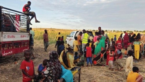 Sudanese people fleeing the al-Jazira state arrive at an area near the eastern city of Gedaref on ...