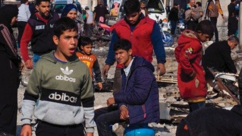 Syrian refugees, who were living in Lebanon, cross the destroyed border between the two countries in ... Syrian refugees, who were living in Lebanon, cross the destroyed border between the two countries in ...
