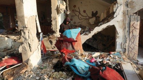 A Palestinian inspects damage at the site of an Israeli strike on a house, amid the Israel-Hamas ... A Palestinian inspects damage at the site of an Israeli strike on a house, amid the Israel-Hamas ...