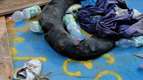 Clothes and a tube used as a buoy are abandoned in a wooden boat used by migrants to cross the ... Clothes and a tube used as a buoy are abandoned in a wooden boat used by migrants to cross the ...