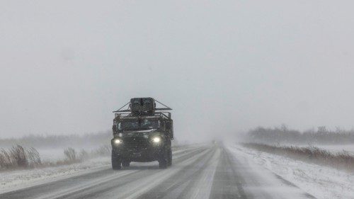 A Ukrainian armoured military vehicle drives along a road during snowfall in the eastern Donetsk ... A Ukrainian armoured military vehicle drives along a road during snowfall in the eastern Donetsk ...