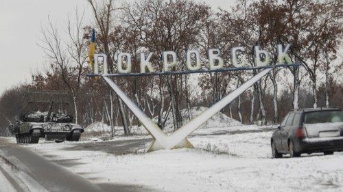 A Ukrainian tank and a car are parked near a road sign that reads, 'Pokrovsk, amid Russia's attack ... A Ukrainian tank and a car are parked near a road sign that reads, 'Pokrovsk, amid Russia's attack ...