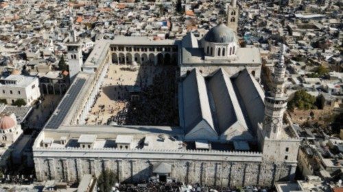 A drone view shows people at Umayyad Mosque, after fighters of the ruling Syrian body ousted Syria's ... A drone view shows people at Umayyad Mosque, after fighters of the ruling Syrian body ousted Syria's ...