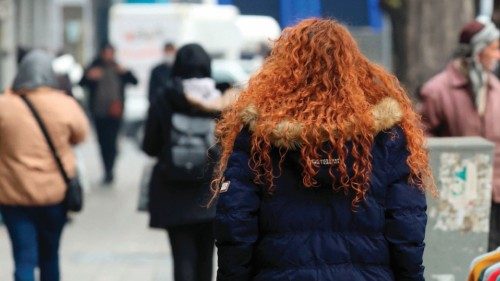An Iranian woman, not wearing the mandatory hijab, walks in a street in the capital Tehran on ... An Iranian woman, not wearing the mandatory hijab, walks in a street in the capital Tehran on ...