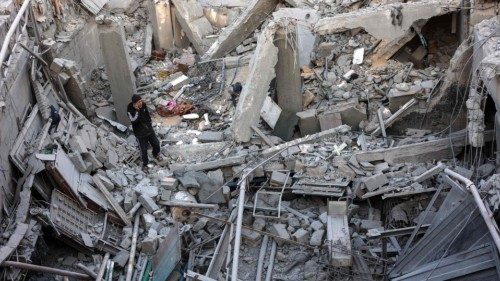 TOPSHOT - A man inspects the damage following an Israeli strike on a home belonging to the ... TOPSHOT - A man inspects the damage following an Israeli strike on a home belonging to the ...