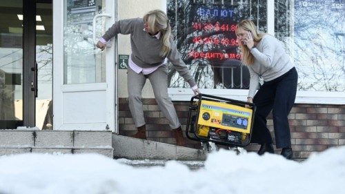 Employees move a generator supplying a bank branch with electricity during a power outage in the ... Employees move a generator supplying a bank branch with electricity during a power outage in the ...