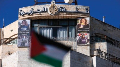 Pictures of slain Palestinian journalist Shireen Abu Akleh are hung across the facade of the ... Pictures of slain Palestinian journalist Shireen Abu Akleh are hung across the facade of the ...