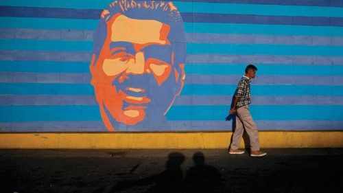 TOPSHOT - A man walks past a mural depicting Venezuelan President Nicolas Maduro in Caracas on ... TOPSHOT - A man walks past a mural depicting Venezuelan President Nicolas Maduro in Caracas on ...