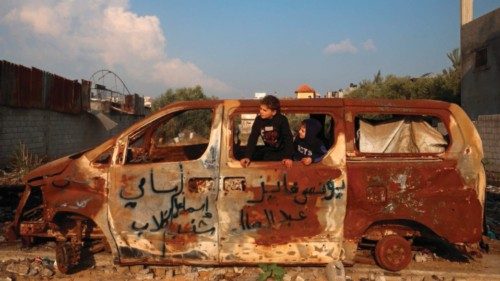 TOPSHOT - Boys play inside a car that was destroyed in an Israeli airstrike near the Nuseirat ... TOPSHOT - Boys play inside a car that was destroyed in an Israeli airstrike near the Nuseirat ...