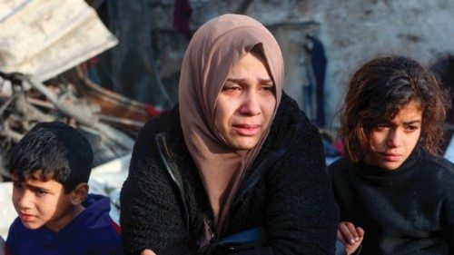 A woman cries as she watches the destruction in the aftermath of an Israeli strike at the Al-Farabi ... A woman cries as she watches the destruction in the aftermath of an Israeli strike at the Al-Farabi ...
