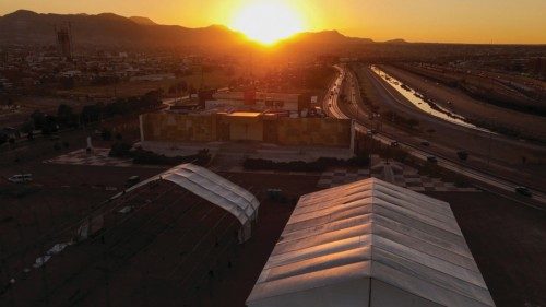 A drone view shows workers setting up a giant tent, where Mexican authorities will build a temporary ...