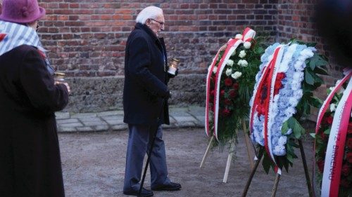 A survivor walks with a candle at the Death Wall during the 80th anniversary of the liberation of ... A survivor walks with a candle at the Death Wall during the 80th anniversary of the liberation of ...