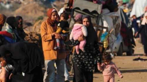 Displaced Palestinians make their way from the south to the northern parts of the Gaza Strip, on ... Displaced Palestinians make their way from the south to the northern parts of the Gaza Strip, on ...