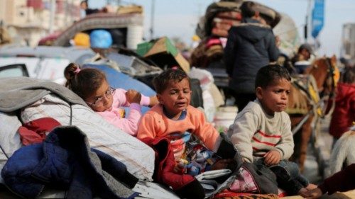 Palestinian children wait to be allowed to return to their homes in northern Gaza after they were ... Palestinian children wait to be allowed to return to their homes in northern Gaza after they were ...