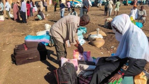 People displaced by the ongoing war in Sudan wait to board buses taking them home to their city of ...