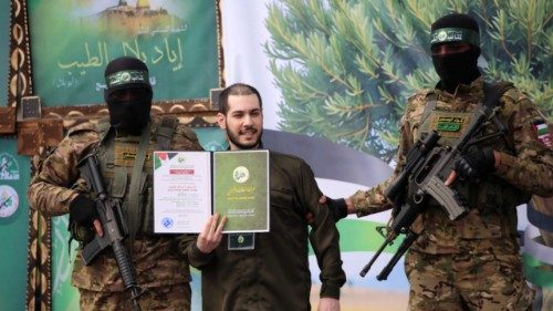 Hamas fighters accompany Israeli hostage Eliya Cohen to be handed over to the Red Cross in Nuseirat ... Hamas fighters accompany Israeli hostage Eliya Cohen to be handed over to the Red Cross in Nuseirat ...