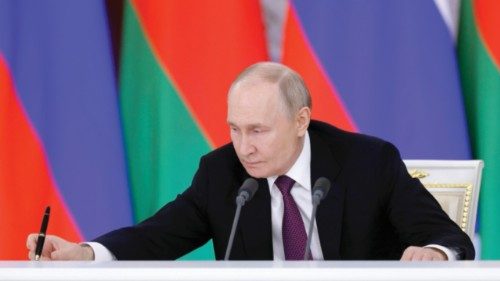 epa11961441 Russian President Vladimir Putin attends a press conference following a meeting with his ... epa11961441 Russian President Vladimir Putin attends a press conference following a meeting with his ...
