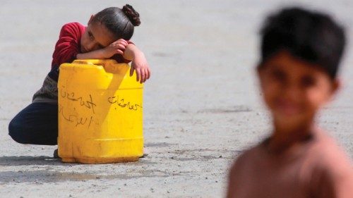 TOPSHOT - A girl rests while ferrying water as Palestinians leave Beit Hanun in the northern Gaza ... TOPSHOT - A girl rests while ferrying water as Palestinians leave Beit Hanun in the northern Gaza ...