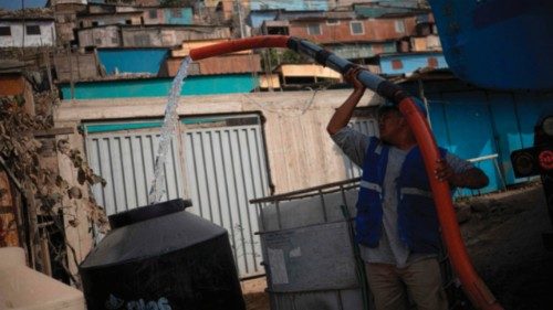 A water delivery man fills water drums from a tanker in Pamplona Alta, on the southern outskirts of ... A water delivery man fills water drums from a tanker in Pamplona Alta, on the southern outskirts of ...