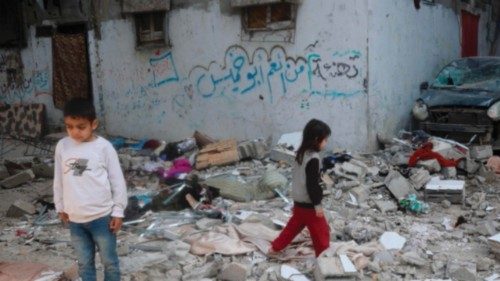 EDITORS NOTE: Graphic content / Palestinian children stand on rubble after an earlier Israeli strike ... EDITORS NOTE: Graphic content / Palestinian children stand on rubble after an earlier Israeli strike ...