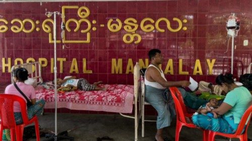 TOPSHOT - Patients lie on beds and chairs in the compound of Mandalay General Hospital in Mandalay ... TOPSHOT - Patients lie on beds and chairs in the compound of Mandalay General Hospital in Mandalay ...