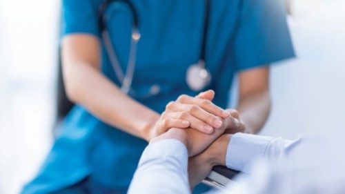 Cropped shot of a female nurse hold her senior patient's hand. Giving Support. Doctor helping old ... Cropped shot of a female nurse hold her senior patient's hand. Giving Support. Doctor helping old ...