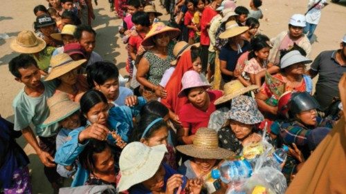 People line up for food aid being distributed in Sagaing on April 3, 2025, following the March 28 ... People line up for food aid being distributed in Sagaing on April 3, 2025, following the March 28 ...